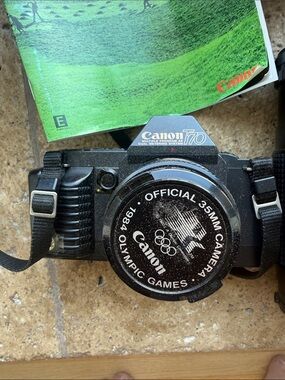 Canon Black Camera with accessories Telephoto Lens and Blue Carry Bag